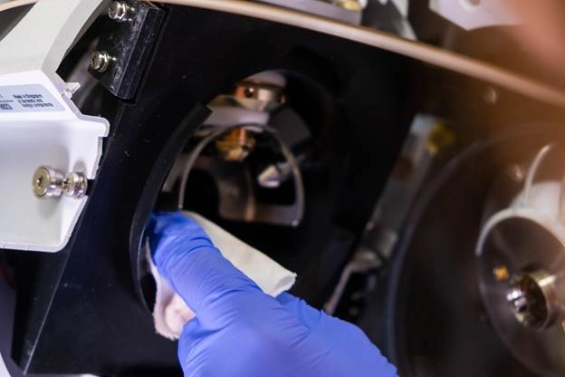 A gloved hand in a blue glove cleaning a machine

AI-generated content may be incorrect.