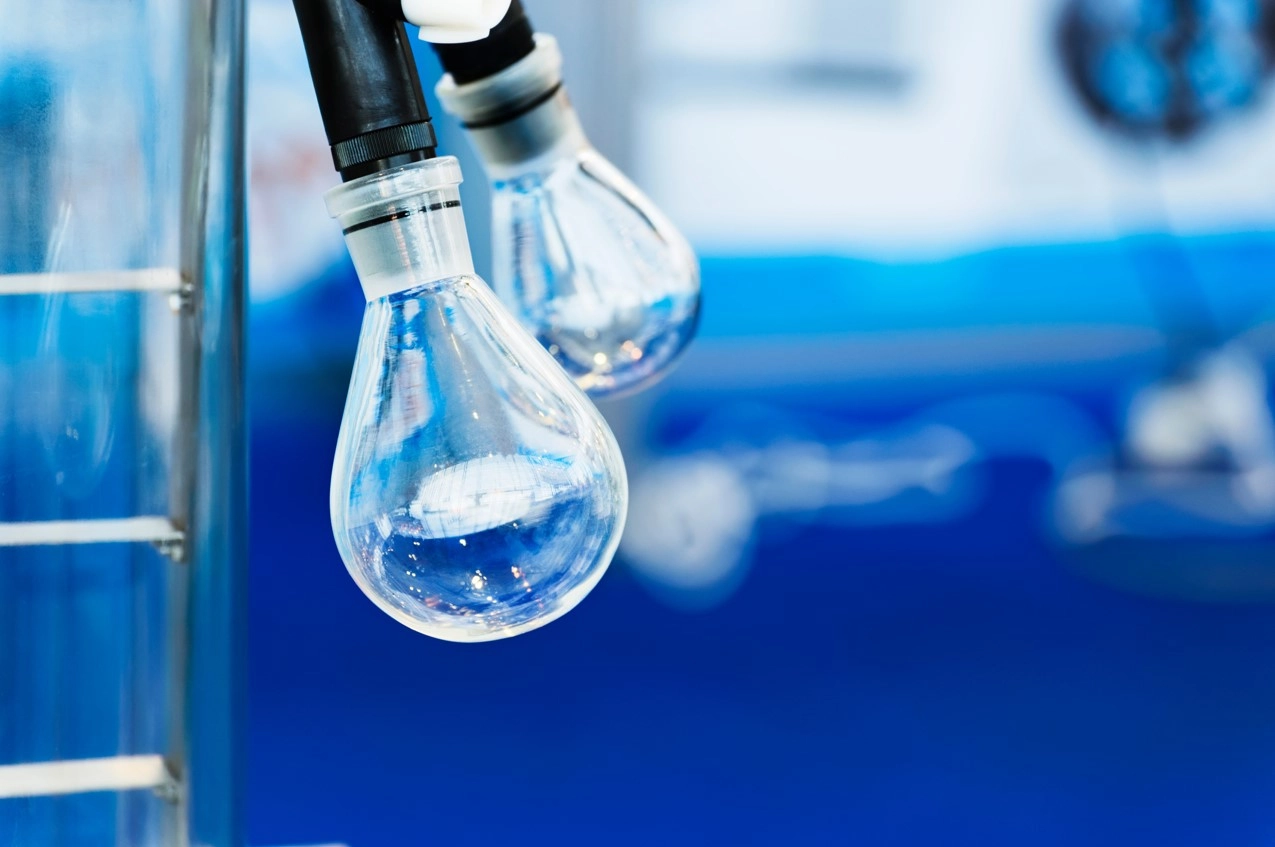 image of 2 rotary evaporator bulbs with blue background demonstrating safe use