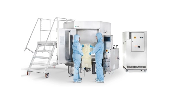 The Xcellerex being loaded by two lab technicians on a white background