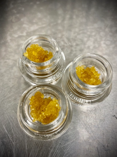 resin crystals in three glass dab jars