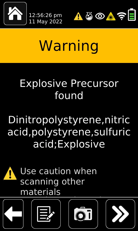 A screenshot example of a warning presented by the ResQ CQL device. A yellow band at the top of the screen says Warning, below that is the text "Explosive Precursor found" followed by "Dinitropolystyrene,nitric acid,polystyrene,sulfiric acid;Explosive" and below that is a yellow warning triangle and the text "Use caution when scanning other materials"