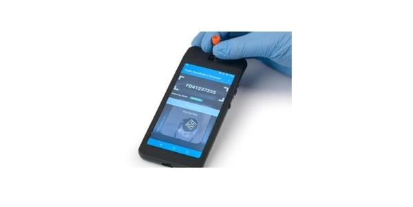 Person wearing gloves using the handheld 2 on a white background