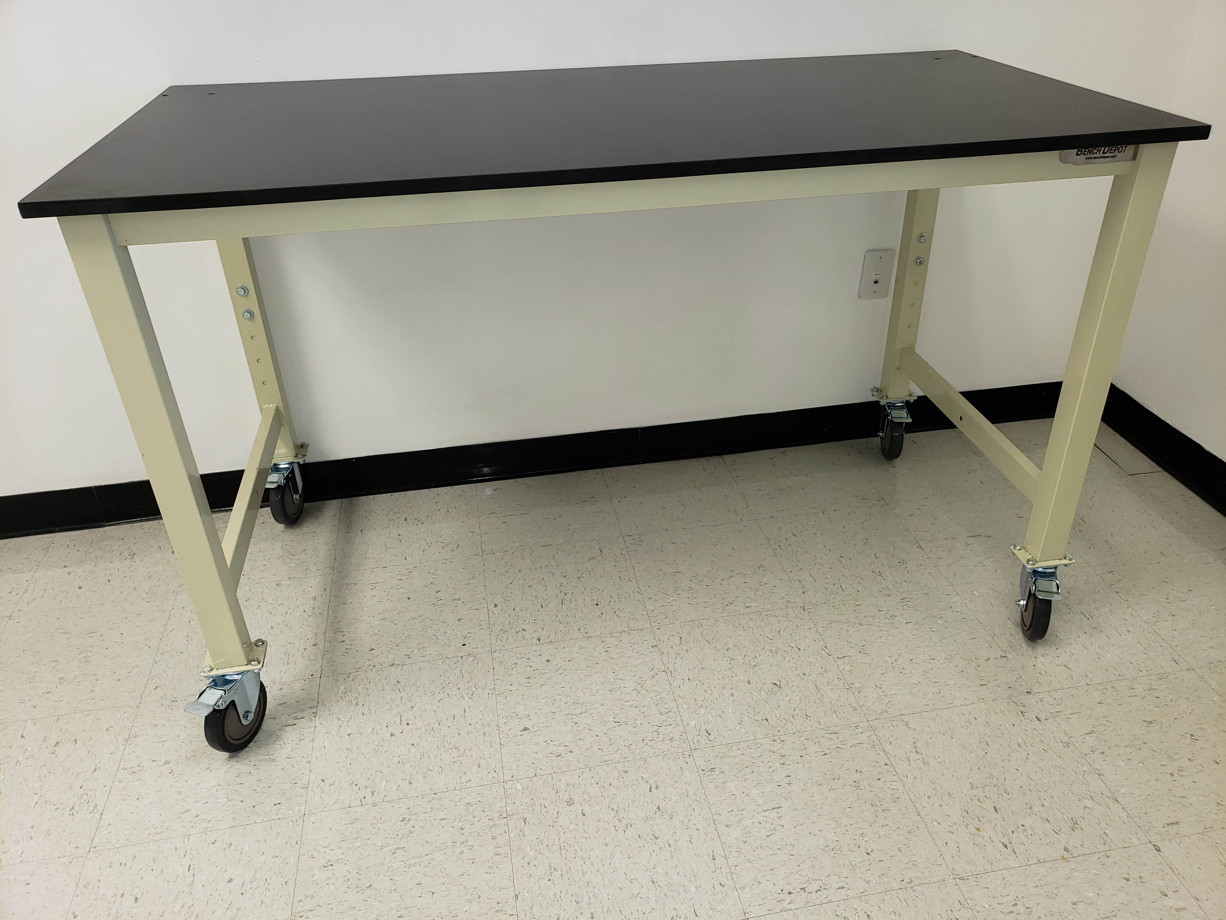 Laboratory table: 8 ft x 30"deep adjustable height with plastic laminate top