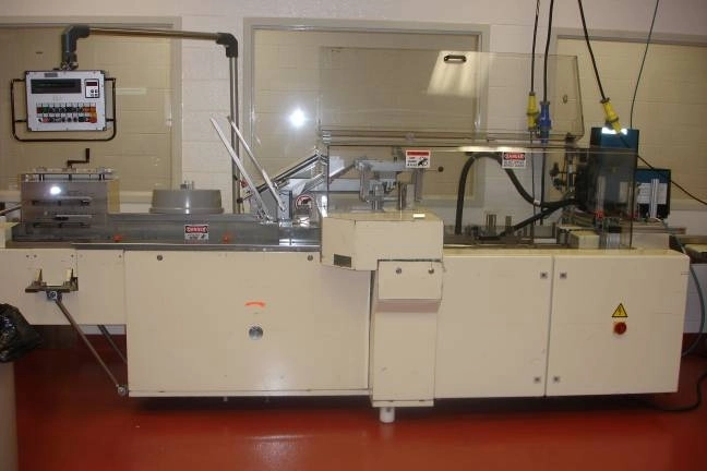 Used Brunner Horizontal Combination Reverse Tuck and Hot Glue Intermittent Motion Cartoner Model CMI-11
