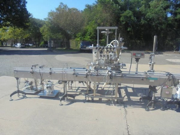 Inline Filling Systems &ldquo;Servo&rdquo; Six Nozzle Auto Positive Displacement Pump Style Filling Line, 15 ft. conveyor