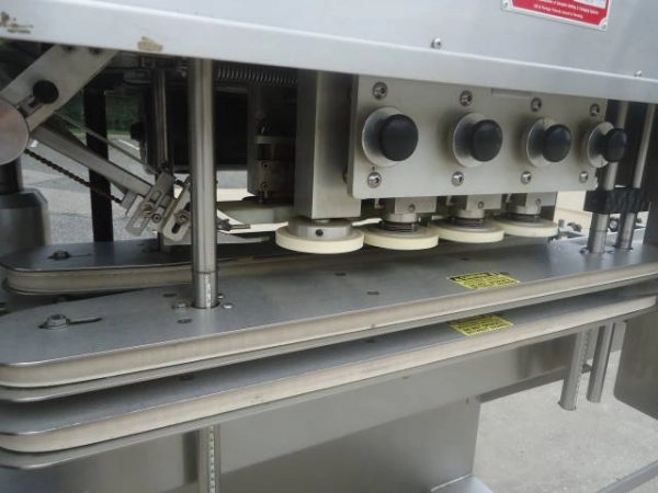 Kaps-All Model &ldquo;C&rdquo; Eight Spindle Capper