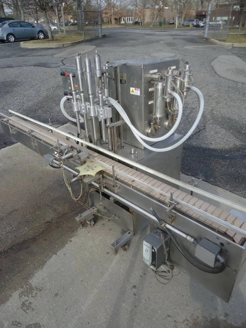 NATIONAL INSTRUMENT &ldquo;FILAMATIC&rdquo;&rdquo; FOUR PISTON FILLER WITH CONVEYOR, 32 oz. pistons