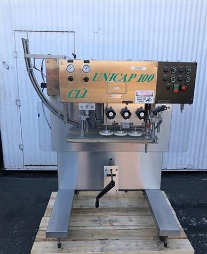 NJM / CLI Unicapper, six spindle capper.