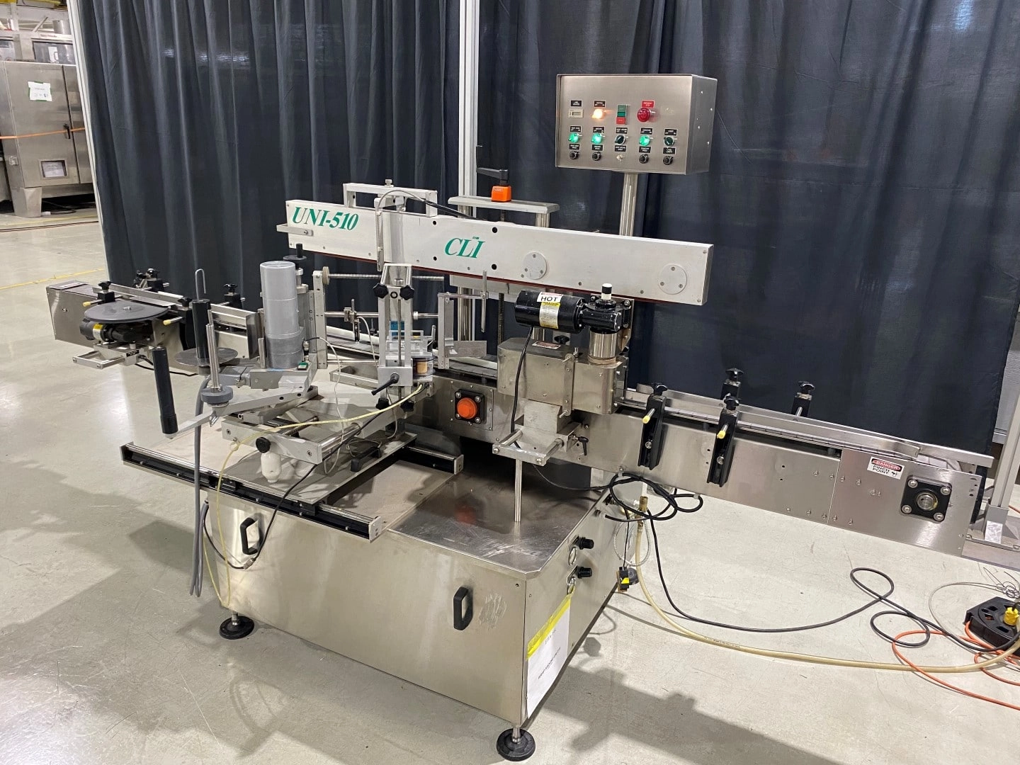 Used CLI single head wrap around labeler model UNI-510 for round bottle or single panel labeling