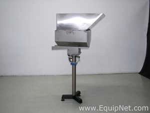 Used Stainless steel Orientech vibratory cap feeder with chute