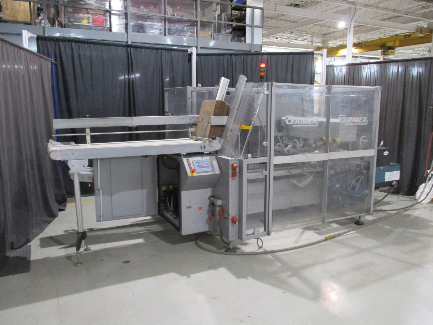 Used Cermex automatic side load case packer model SB27 for glue application