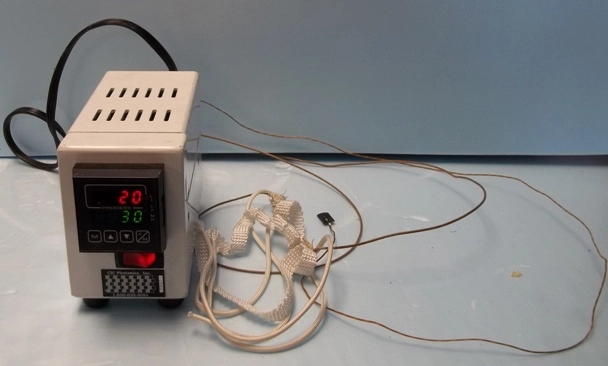 CIC PHOTONICS, INC TEMPERATURE CONTROLLER, FOR CONTROLLING HEAT WRAP THAT ATTACHED