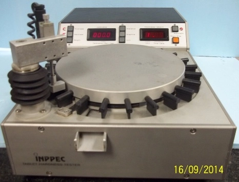 INPPEC TABLET HARDNESS TESTER, WITH 24 SLOT CARROUSEL, HAS BUTTONS FOR THICKNESS, AND HARDNESS, AND 