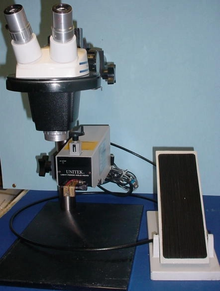 Unitek reflow soldering/welding system: Unitek PMIV, Unitek light force 46F Thinline head with cable foot pedal, Bausch and Lomb Stereozoom 4 microscope with 10X eyepieces and .5X supplemental lens for 7&rdquo; focal distance,