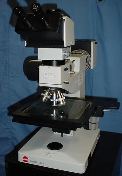 Leitz Ergolux trinoccular, 6x6 stage, 12.5 Periplan eyepieces, NPL5 , 20, and 50df motorized turret and laser focus. 100 watt illuminator