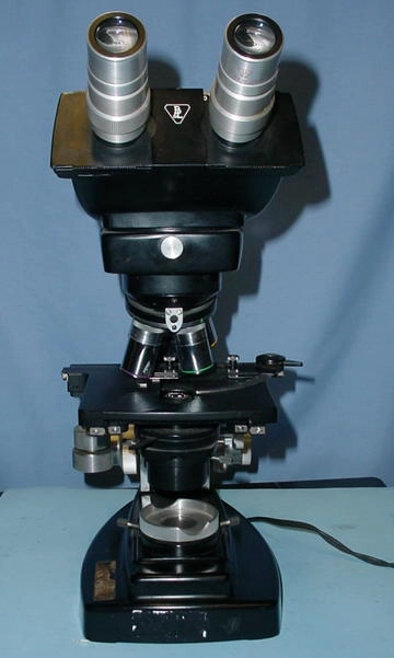 BandL Binocular Dyna Zoom, 10 x eyepieces, 1-2 zoom, 10, 20, 40 and 100 (oil) objectives, 2" x 2" mech. stage, illuminator and abbe condenser in base.