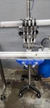 Inline Filling Systems Semi Automatic Four Head Overflow Filler