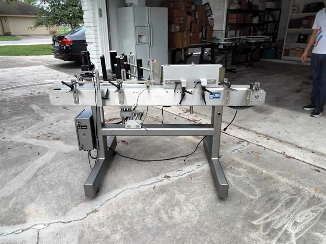 Quadrel model Moduline wraparound pressure sensitive labeler