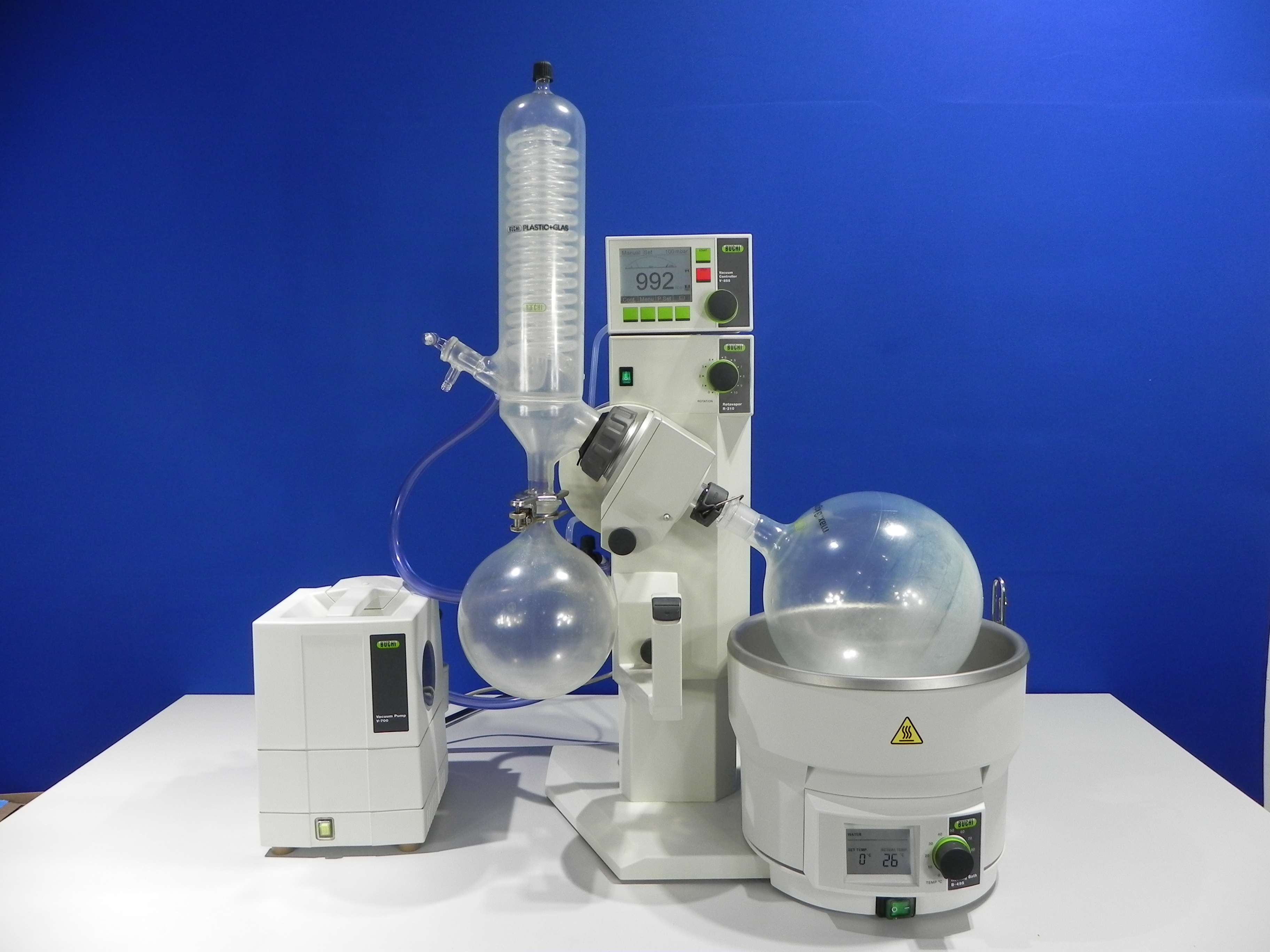 Buchi R-210 rotary evaporator integrated with Buchi V-850 vacuum controller, Buchi V-700 diaphragm vacuum pump and digital B-495 heating bath.