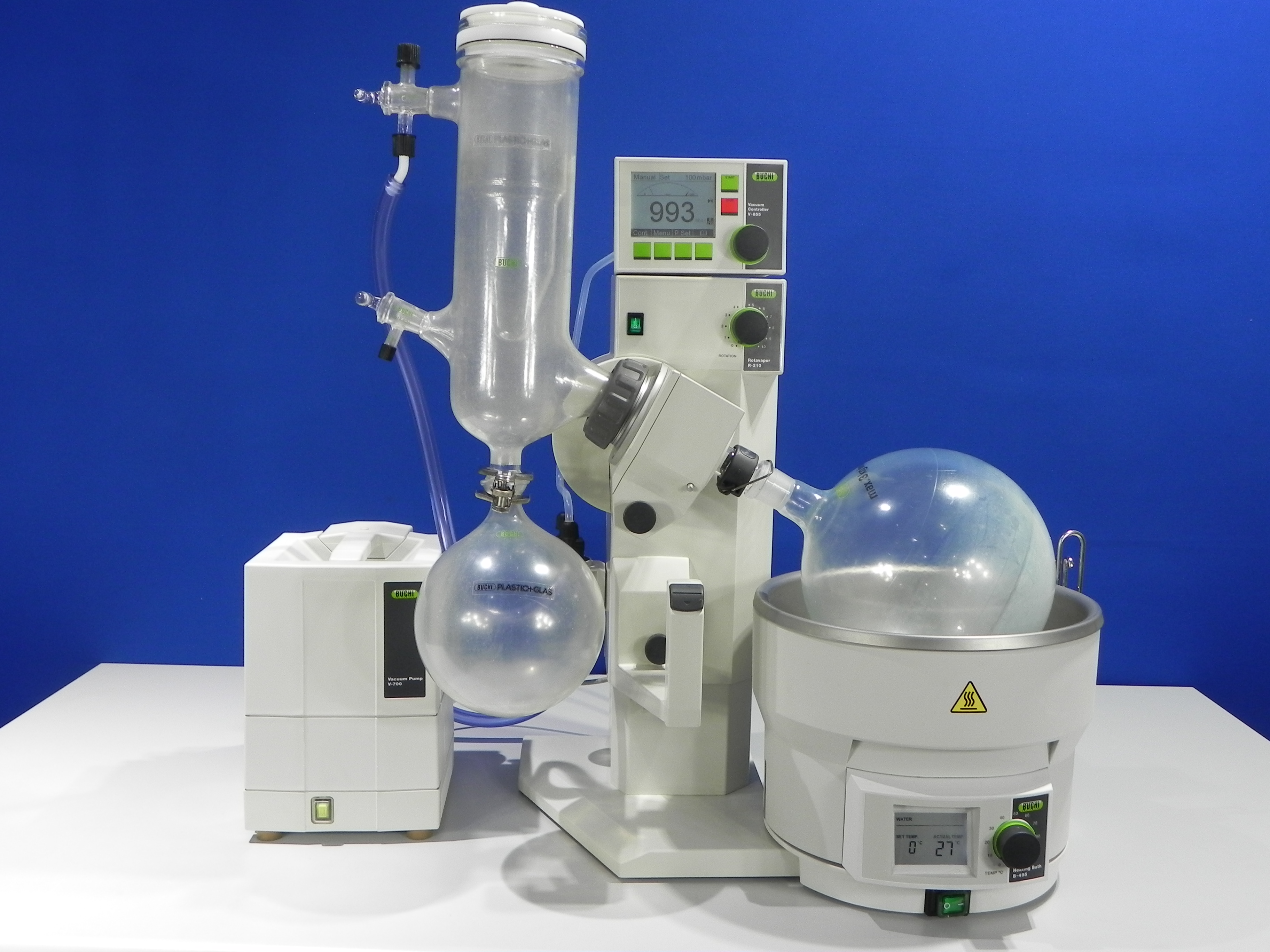 Buchi R-210 rotary evaporator integrated with Buchi V-850 vacuum controller, Buchi V-700 diaphragm vacuum pump, digital B-495 heating bath.