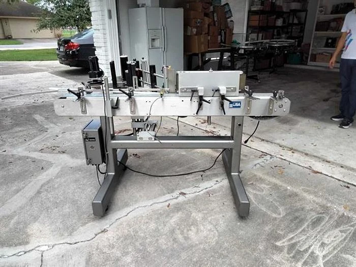 Quadrel model Moduline wraparound pressure sensitive labeler