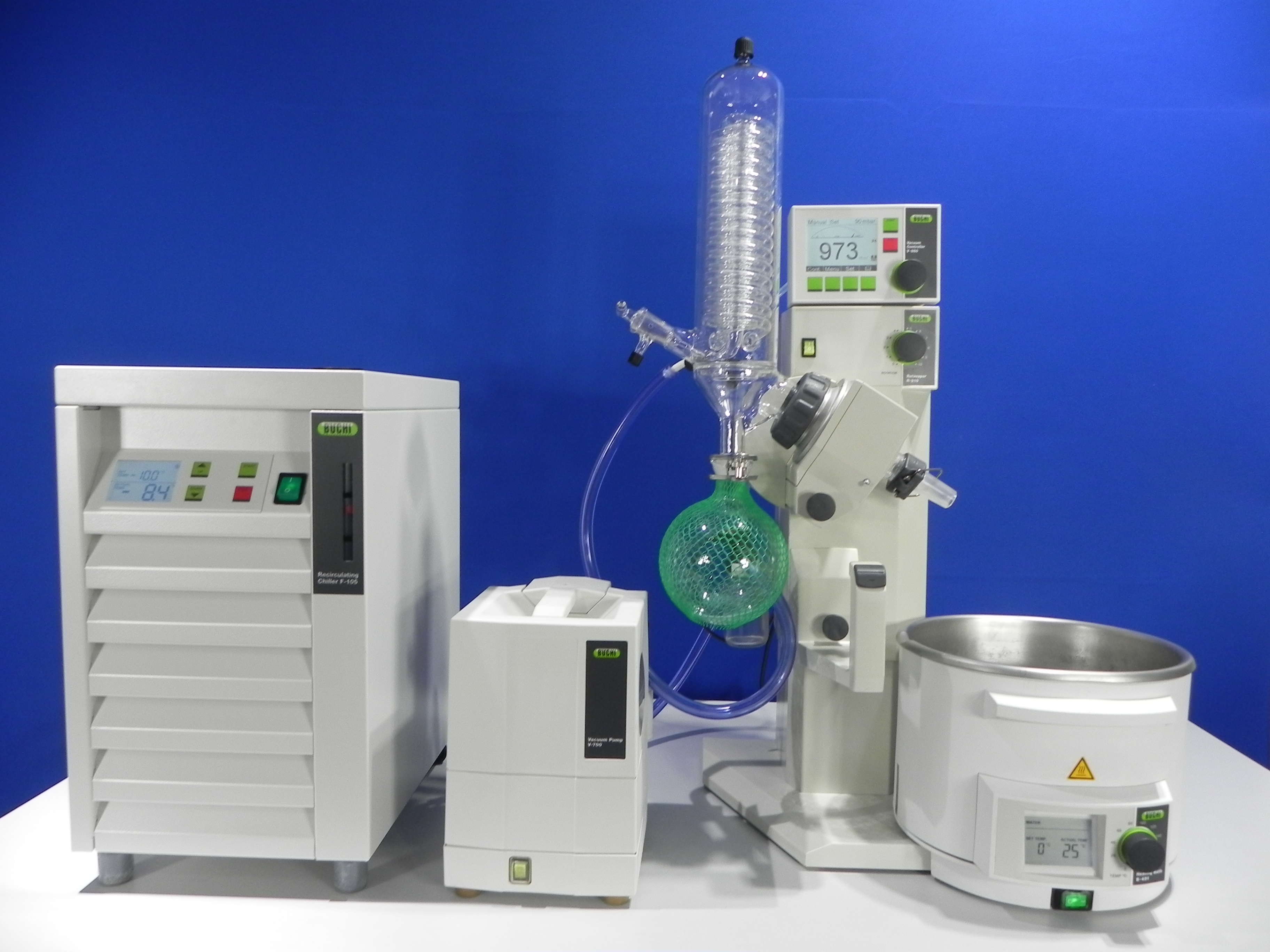Buchi R-210 rotary evaporator integrated with Buchi V-850 vacuum controller, Buchi V-700 diaphragm vacuum pump, digital B-491 heating bath and Buchi F-105 Chiller.