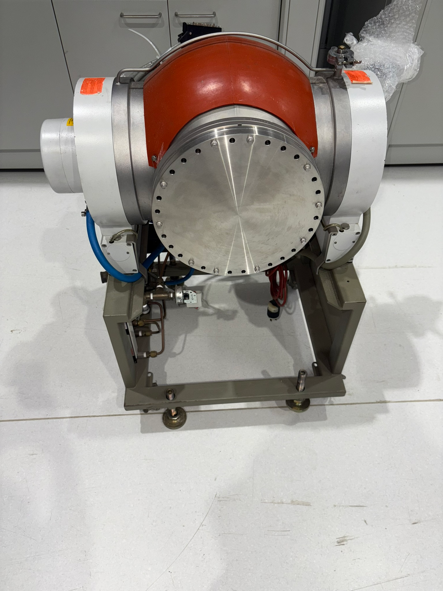 Water-Cooled UHV Outgassing Chamber for MBE K-Cells 