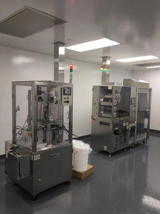 (2)  Qualicaps  filling  and  sealing  machine